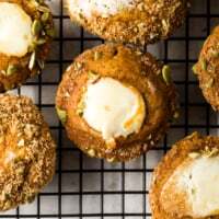 Homemade Pumpkin Cream Cheese Muffins Recipe with streusel and pepitas. Moist, spiced pumpkin muffins filled with sweet cream cheese. Starbucks Copycat.