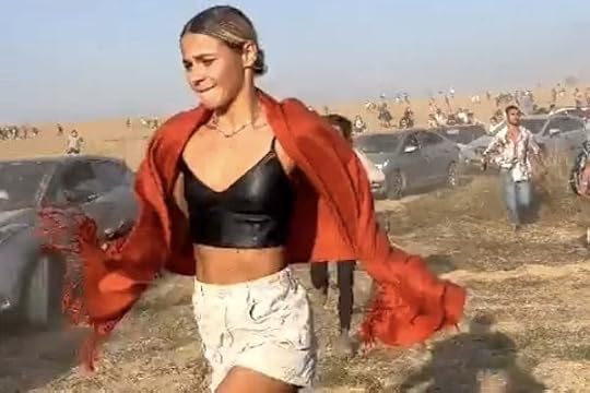 A young woman attending a concert in Israel flees as Hamas terrorists open fire on Saturday, Oct. 7, 2023 (Video screenshot)
