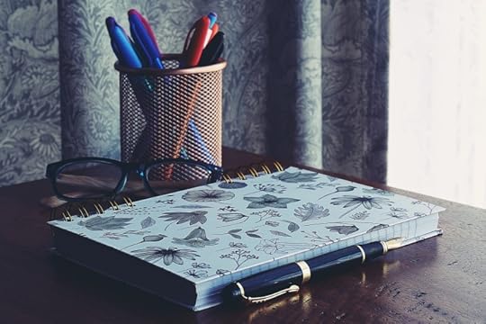 Photo of a journal and pens