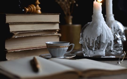 Books and candles on a desk