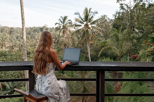 female digital nomad in bali working on laptop