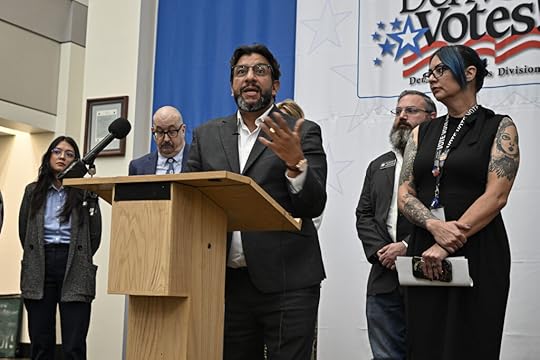 a denver city official speaks at a podium