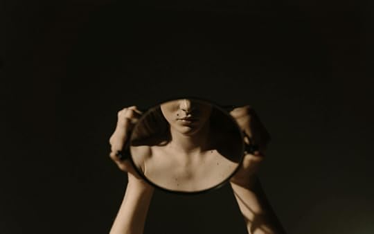 A woman's reflection in a mirror