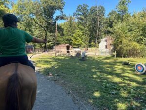 An archer on a horse drawing arrow