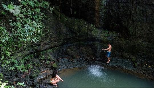 waterfall with people in corcovado national park