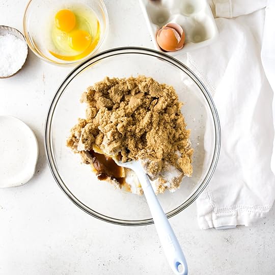 Creaming together brown butter, brown sugar, granulated sugar and vanilla in a mixing bowl.