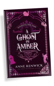 Special edition hardcover book of A Ghost in Amber by Anne Renwick, featuring symbolic elements like a snail, yew branch, stars, gravestone, and ghostly silhouette. Blends steampunk, gothic romance, and the paranormal.