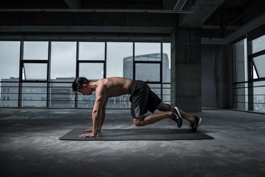 Man exercising in a gym to boost focus and energy for finding his purpose and passion
