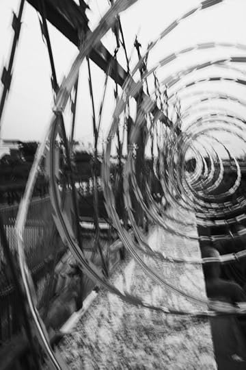 Black-and-white spiral tunnel with motion blur, suggesting a shift in perception and changing reality with your mind.