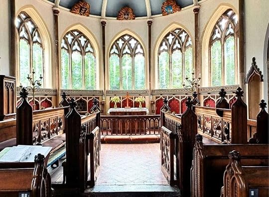 Moreton Church Dorset Windows. Each etched window has an individual theme