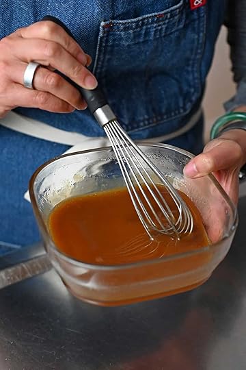The finished maple dijon mustard glaze for the turkey meatballs after it has been heated in the microwave.