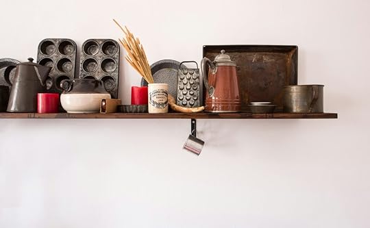 Some examples of kitchen gadgets placed on a shelf, some of which will need to be rid of when Kitchen downsizing 