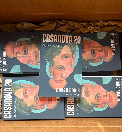 An open cardboard box full of copies of 