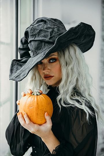 witch holding a pumpkin