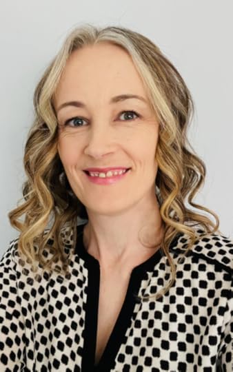 SLP Carrie Hahn poses for an indoor portrait