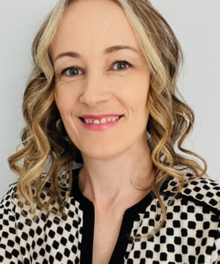 SLP Carrie Hahn poses for an indoor portrait