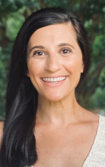 Jordan Arogeti poses for a portrait outside.