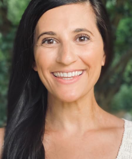 Jordan Arogeti poses for a portrait outside.