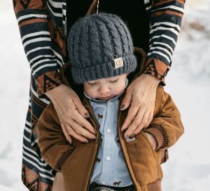 Learning how to choose: a toddler wearing a shirt with buttons.