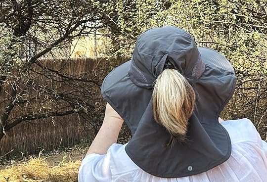 woman peering at lion