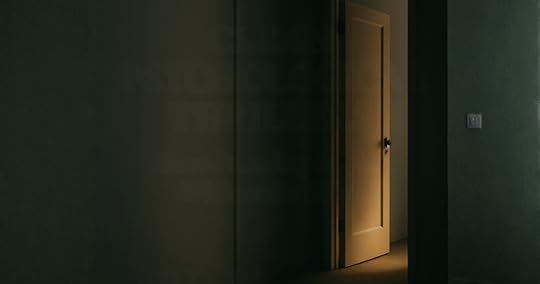 An empty hallway with a door standing ajar. Symbolic of clean psychological thrillers.
