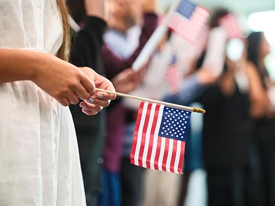 woman holding small American flag