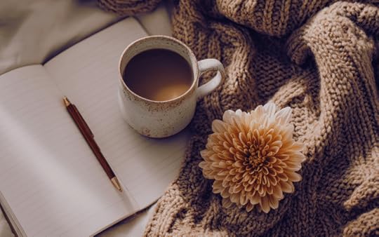 coffee and notebook on a desk