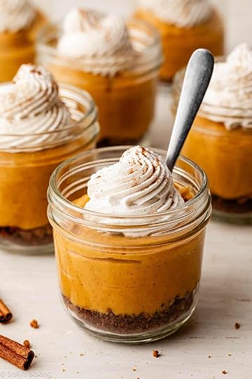 pumpkin pie in a jar with whipped cream.