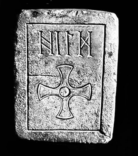 Oblong dressed stone, pitted with age, incised with a rectangular border, inside which are cut runes spelling out HILD, and an equal-armed, Celtic-style cross