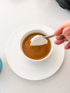 Topping the soup with a dollop of the Greek yogurt