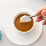 Topping the soup with a dollop of the Greek yogurt