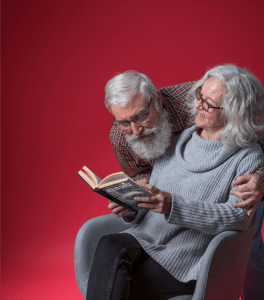 Off-duty Santa and Mrs. Claus enjoy reading Crimes Upon a Midnight Clear, by Joslyn Chase