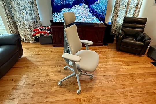 LiberNovvo Omni chair in a family room in front of a big screen TV.