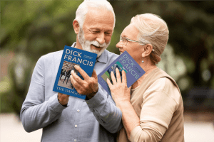 Older couple sharing the enjoyment of reading Dick Francis books