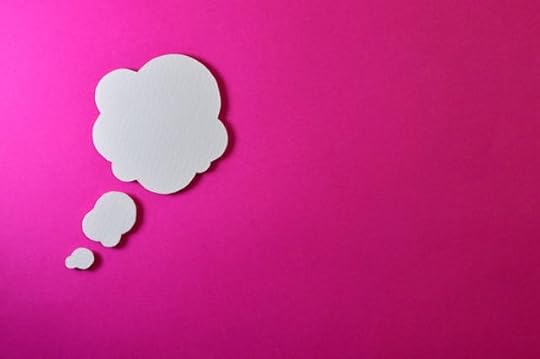 White thought bubble on a bright pink background symbolizing how thoughts create reality