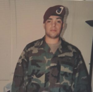 Army soldier wearing a maroon beret