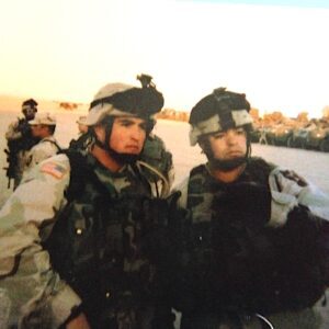 Two soldiers wearing battle gear