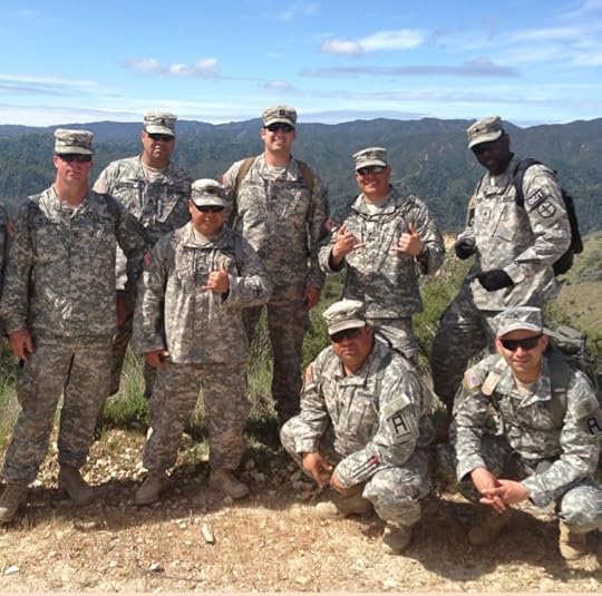 8 male soldiers in Army uniforms