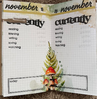 Standard notebook with Currently Reading, listening, writing, loving, watching stamped on the paper