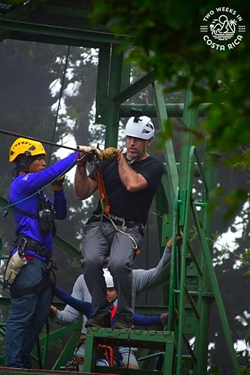 guide helping someone get ready to zipline