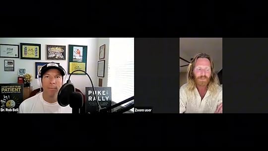 Clear split-screen interview: host with microphone on left and Cameron Balser on the right speaking thoughtfully.