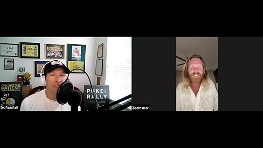 Clear split-screen Zoom interview showing host in a home studio with microphone and guest smiling on the right