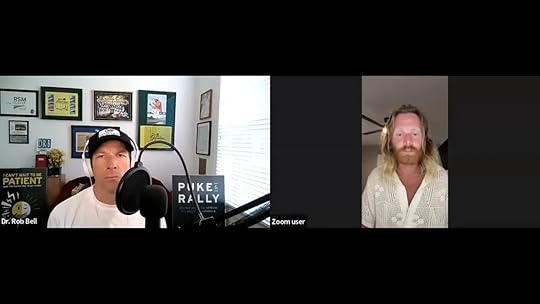 Zoom interview screenshot showing a host at a microphone on the left and a guest looking at the camera while speaking on the right