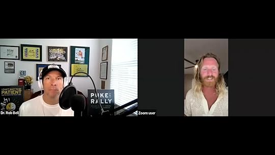 Clear Zoom screenshot showing Dr. Rob Bell at left with microphone and Cameron Balser at right smiling during a discussion about practical solutions.