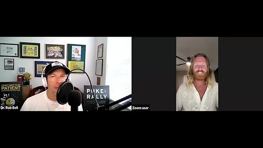 Well‑lit split‑screen Zoom screenshot with the host at a microphone on the left and the guest smiling on the right.