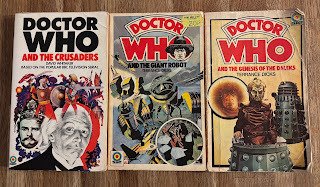 Three Doctor Who novelisations with blood-red titles: Doctor Who and the Crusaders, Doctor Who and the Giant Robot, and Doctor Who and the Genesis of the Daleks
