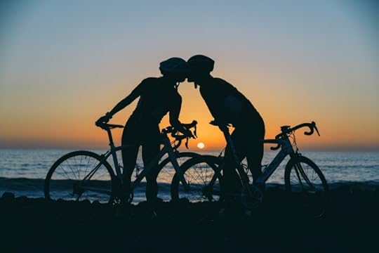People on bicycles pausing to put their heads together at sunset. Choices made are not right or wrong.