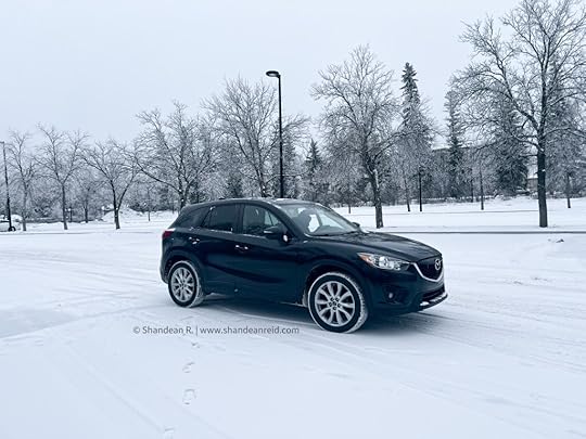 Photo of black Mazda cx-5 SUV parked in a col snow covered park during the winter. Photo by Shandean Reid, lifestyle blogger and communications expert in the Winter Car Emergency Kit blog post on www.shandeanreid.com