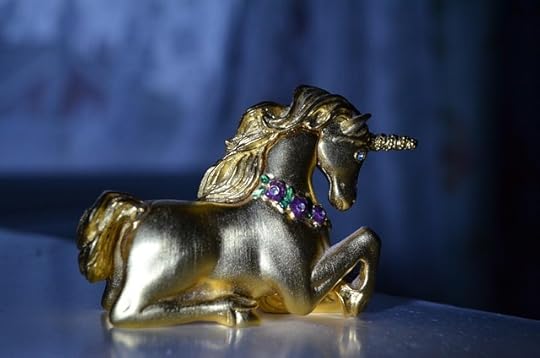 Gold unicorn figurine.