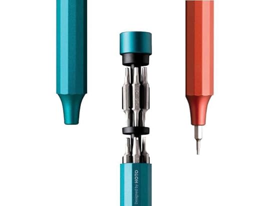 HOTO precision screwdriver opened to reveal tiny bits nestled in a cartridge.